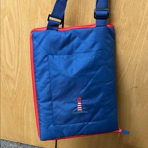 Blue Quilted Bag folds out to blanket/mat with  Embroidered Lighthouse on pocket